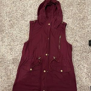 Hooded jacket vest color is maroon